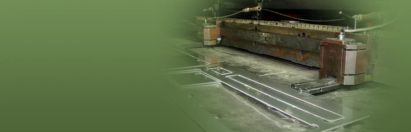 Sheet metal being processed on manufacturing equipment